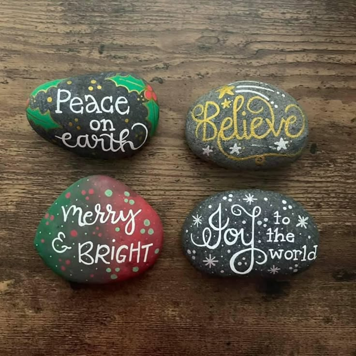 three painted rocks that say peace on earth, merry and bright