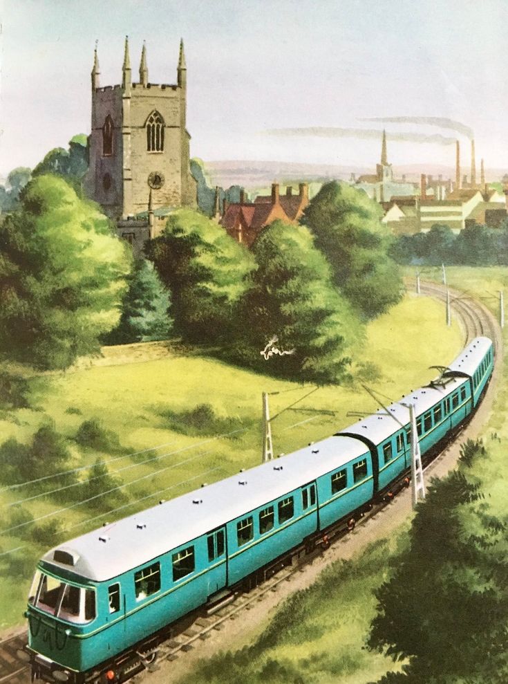 a blue train traveling past a lush green field next to a tall church tower on top of a hill