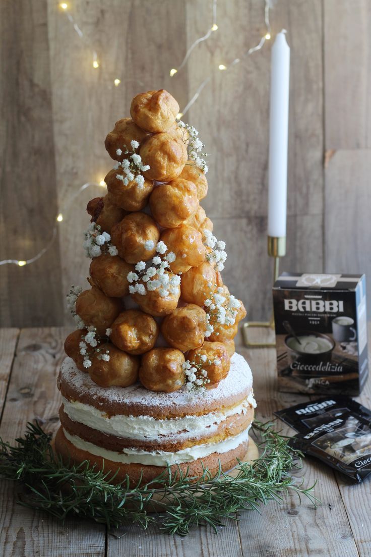 a christmas tree made out of doughnuts and sprinkles on a table