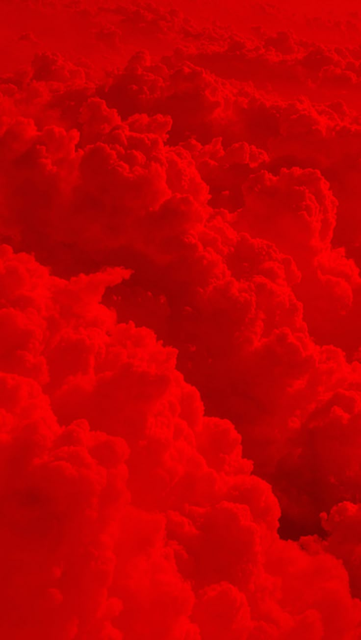 red clouds are seen from an airplane in the sky, as it flies through the air