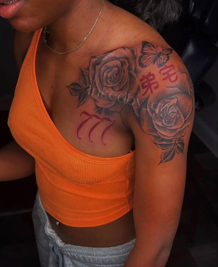 a woman wearing an orange top with tattoos on her chest