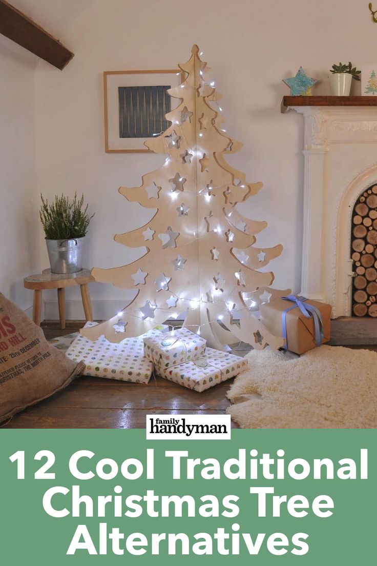 a white christmas tree sitting on top of a wooden floor next to a fire place