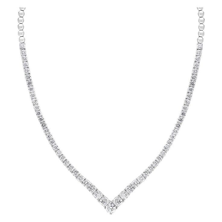 A simple yet very brilliant piece showcasing round diamonds that elegantly graduate larger as it reaches the center of the necklace. 85 Diamonds weigh 5.05 carats total and are very fine quality Made in 14k White Gold. 17 inches in length. Box Clasp with double lock mechanism. All diamonds are GH color SI1 Clarity. Available in Yellow and Rose Gold. Style available in different price ranges. Prices are based on your selection. Please contact us for more information. Classic Round Bridal Necklace With Vvs Clarity, Classic Bridal Necklace With Round Cut Single Diamonds, Classic Bridal Necklace With Round Diamond Accents, Timeless Round Cut Formal Necklace, Refined Diamond White Necklace For Formal Occasions, Classic Bridal Necklace With Diamond Accents, Classic Formal Necklaces With Single Cut Diamonds, Classic Cubic Zirconia Tennis Necklace For Formal Occasions, Classic Round Cut Diamond Bridal Necklace