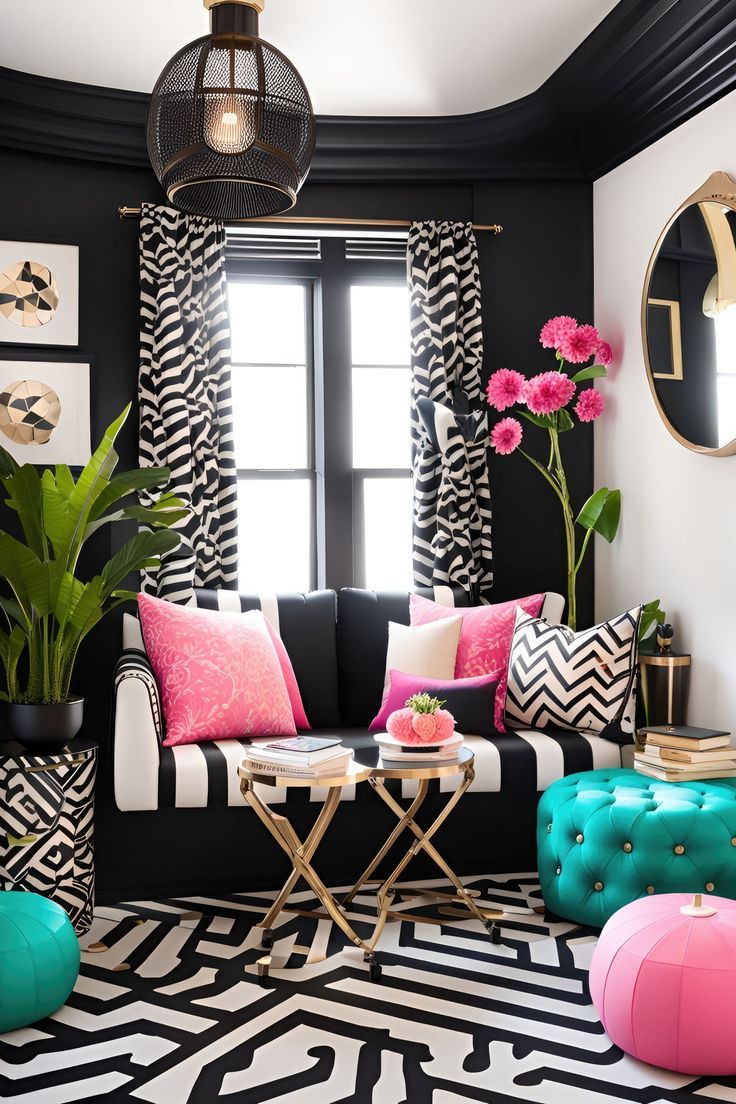 a black and white living room with pink accents