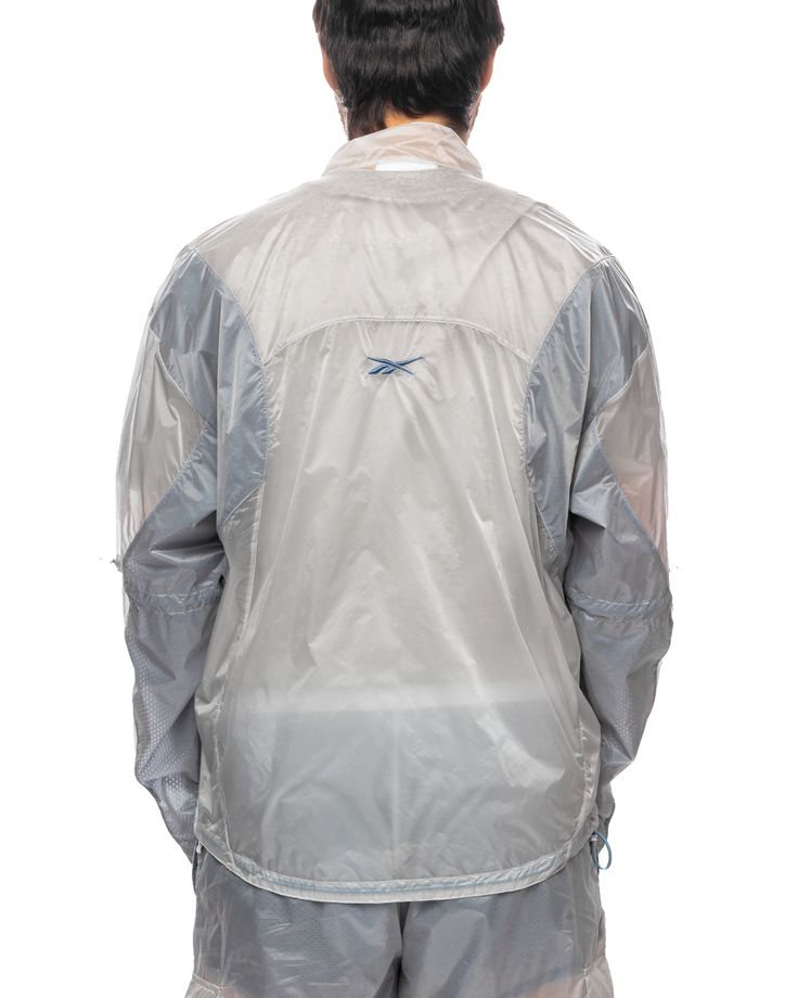 Reebok revisits one of its iconic silhouettes with a contemporary twist, evoking the silhouette of the vintage track jacket. 100% Polyamide See Through Fabric Relaxed Fit High Collar Contrasting Inserts Zip Closure Embroidered Appliqué Logo at Back Elasticated Cuffs and Hem Made in Italy Vintage Track Jacket, Sports Graphic Design, Crystal Blue, Clothing Ideas, Track Jacket, Track Jackets, High Collar, The Vintage, Nook