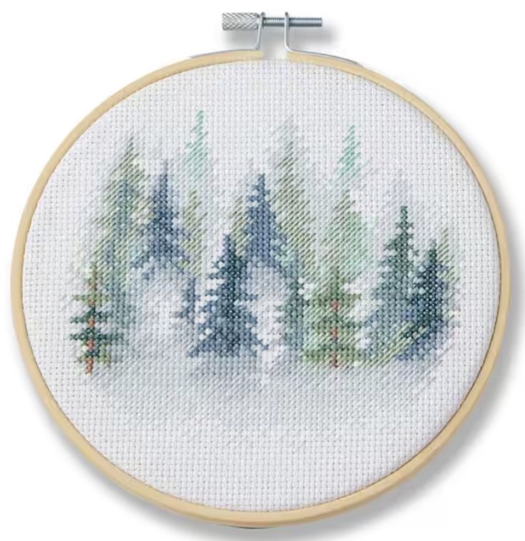 a cross stitch pattern with pine trees in the snow on a white background, it is easy to sew and can be used as a wall hanging ornament