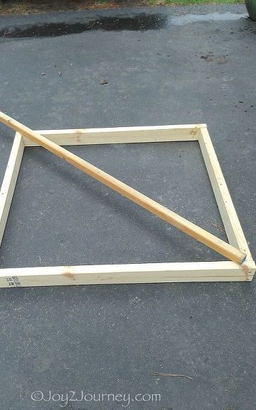 a wooden frame sitting on the ground