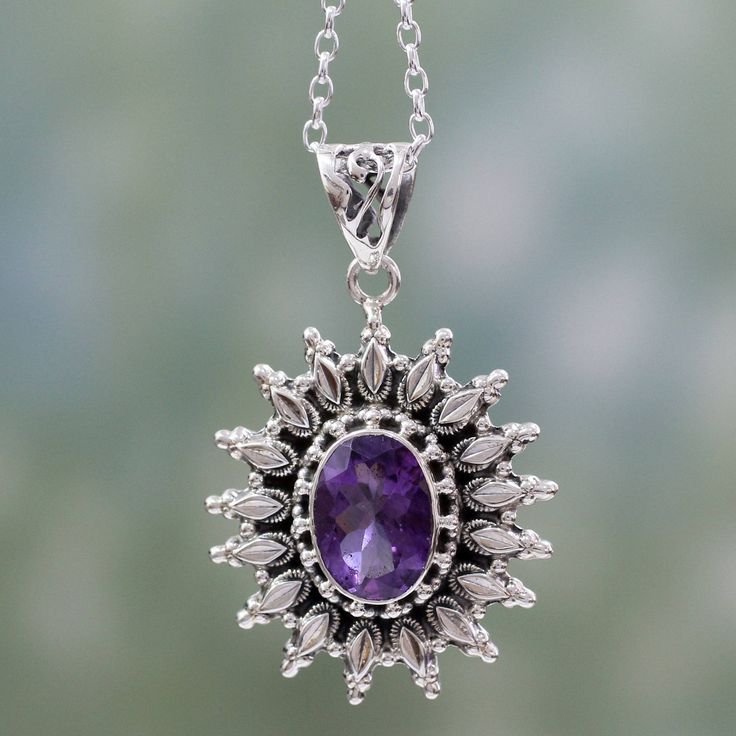 A dazzling sunburst showcases a faceted amethyst that totals 3.5 carats. From Neeru Goel in India this chain and pendant necklace is handcrafted of sterling silver. .925 Sterling silver