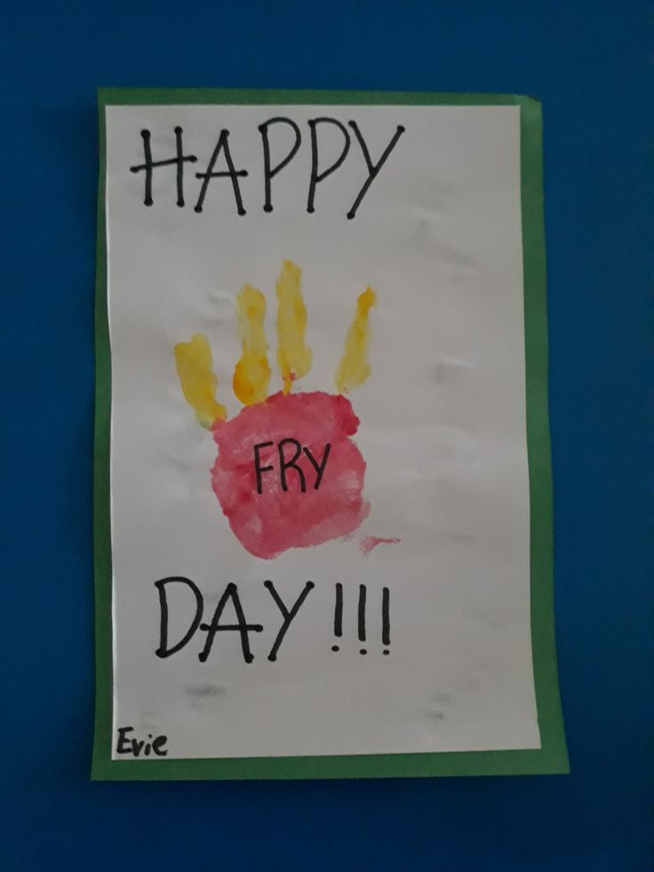 a child's handprinted sign on a blue wall reads happy fry day