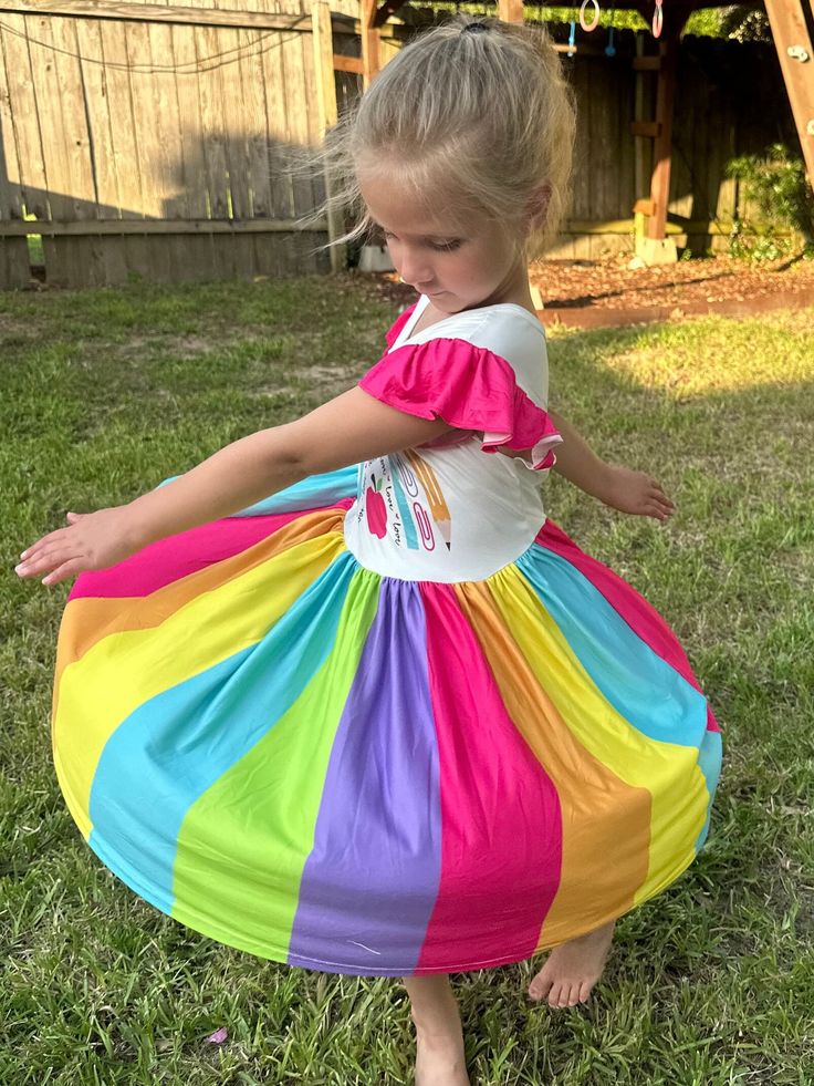 Back to School Flutter dress. Moderate twirl. Rainbow colors on the bottom for a beautiful twirl. School supplies in the rainbow on bodice Summer Flowy Twirl Dress For Playdate, Flowy Twirl Dress For Summer Playdate, Multicolor Ruffle Twirl Dress For Playdate, Summer Playtime Twirl Dress With Ruffle Hem, Multicolor Ruffled Twirl Dress For Playdate, Summer Twirl Dress With Ruffle Hem For Playtime, Playful Pink Flowy Twirl Dress, Cute Flowy Twirl Dress With Ruffles, Spring Playtime Twirl Dress With Flutter Sleeves