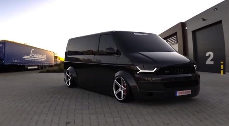 a black van parked in front of a building