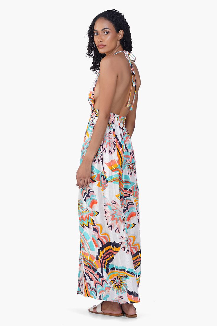 Cotton printed fabric Cool summer print maxi dress Elasticated waist all around belt for a comfortable fit Backless design adds allure Front halter tie dori knot for adjustable neckline Gathers at waist create a flattering silhouette Full length dress for a graceful look Side slits for added movement and style Our Sunflora Maxi Dress is a captivating blend of beauty and vibrancy, exuding charm and sophistication effortlessly. Crafted from luxurious fabric, its colorful print adds a playful yet e Halter Neck Tie Back Maxi Dress For Summer Parties, Summer Tropical Printed Maxi Dress, Beach Season Sundress Halter Dress With Tie Back, Beach Season Sundress With Tie Back, Tropical Printed Maxi Dress For Summer, Printed Tropical Maxi Dress For Summer, Beach Season Halter Neck Dress With Tie Back, Tie Back Sundress For Beach Season, Flowy Maxi Halter Dress For Day Out