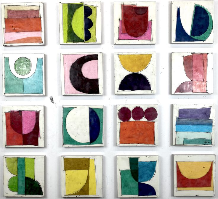 nine abstract paintings are displayed on a wall