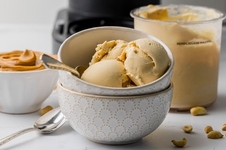 two bowls filled with ice cream and peanut butter