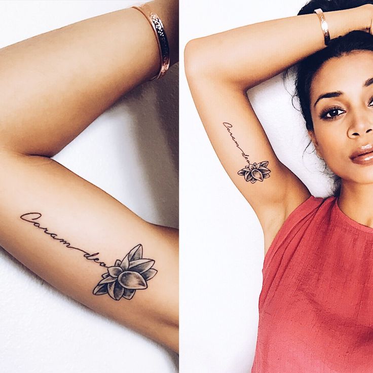 a woman with two tattoos on her arms and one has a flower tattoo on her arm