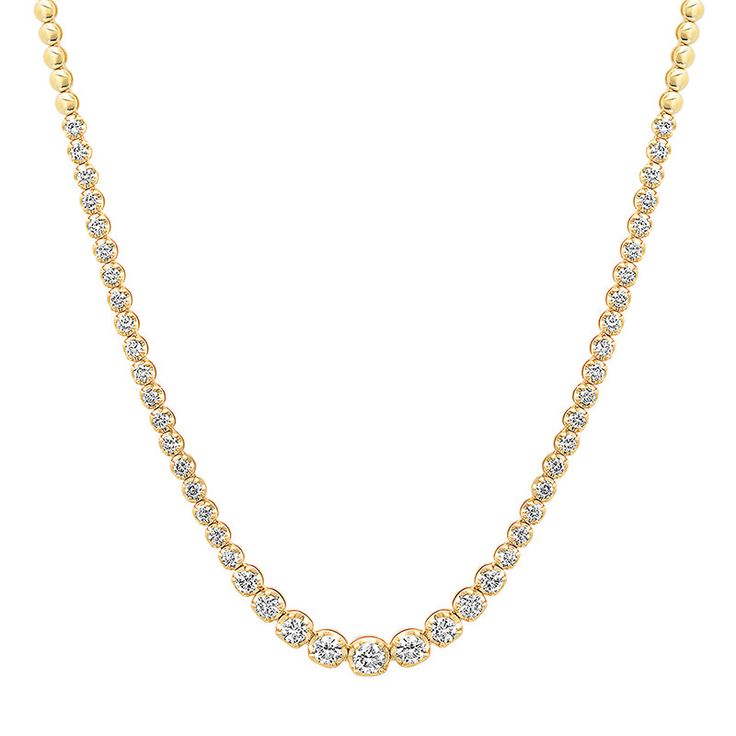 An updated take on a timeless piece, our Diamond Graduated Tennis Necklace is handcrafted in 18-karat yellow gold and set with 2.7 carats of round, brilliant cut diamonds in varying size - with the largest diamonds set in the center and gradually get smaller until they meet the plain, polished gold bezels that comprise the rest of the necklace. Carat Weight: 2.7 ct Necklace measures 16 inches in length Diamond color is G-H Diamond clarity is SI1-SI2 Push Clasp Fastening with Safety Made with lov Yellow Gold Tennis Necklace With Prong Setting, Gold Tennis Necklace With Prong Setting, Yellow Gold Fine Jewelry Tennis Necklace, Luxury Diamond-cut Tennis Necklace For Gift, Fine Jewelry Diamond-cut Tennis Necklace For Formal Occasions, Diamond Tennis Necklace, Tennis Necklace, Diamonds And Gold, Diamond Clarity