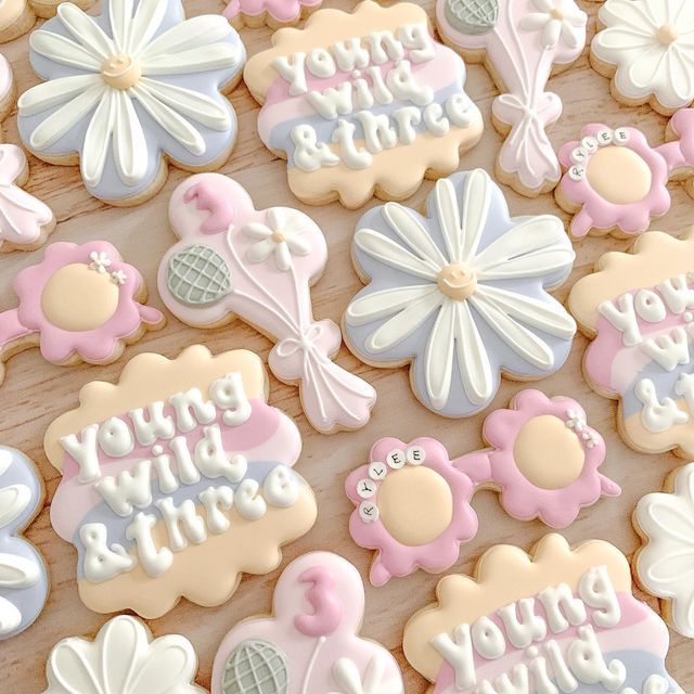 decorated cookies are arranged on a table for someone's special birthday party or baby shower