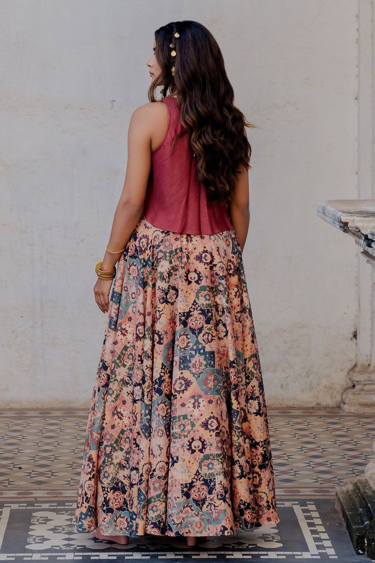 Rust silk pleated lehenga with all over Persian carpet pattern print. Paired with raw silk high neck crop top with zari dori embroidery.
Component: 2
Pattern: Printed and Embroidered
Type Of Work: Persian Carpet Pattern, Zari Dori and Tassels
Neckline: High Neck
Sleeve Type: Sleeveless
Fabric: Lehenga: Silk, Crop Top: Raw Silk 
Color: Brown,Red
Other Details: 
Back pleated detail on top
Attached tassel chains on lehenga
Cut work hem on top
Closure:
Lehenga: Side concealed zip, hook and eye
Occas Red Persian Carpet, Persian Carpet Pattern, Lehenga Silk, Pleated Lehenga, Lehenga Top, Dori Embroidery, Carpet Pattern, Silk Crop Top, High Neck Crop Top