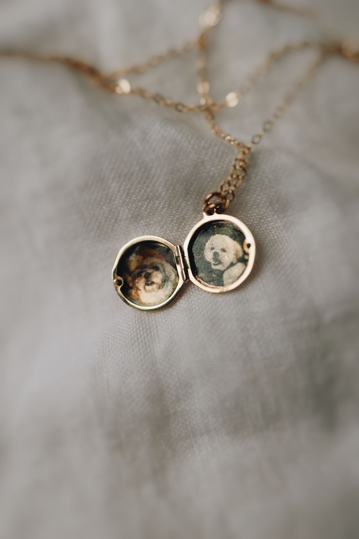 A luxury solid gold or silver locket with your photos transferred onto the metal. Minimal enough to wear everyday and high enough quality to last a lifetime. What Makes it Special:• Something like this literally does not exist! We developed our own unique process, where the photos blend into the metal itself. The color of the metal shines through the image, making it look like the luxury heirloom that it is.• It will last. Think of it as a piece you’ll wear every day and your grandchildren will Luxury Locket Necklace With Polished Finish For Keepsake, Luxury Heirloom Sterling Silver Necklace, Luxury Polished Locket Necklace For Keepsake, Cheap Engraved Locket Necklace For Keepsake, Luxury Unique Locket Jewelry, Luxury Jeweled Necklaces For Gifts, Luxury Heirloom Rings As Gift, Luxury Heirloom Rings For Gifts, Unique Luxury Everyday Jewelry