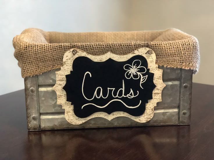 a close up of a box on a table with a label that says cards in it