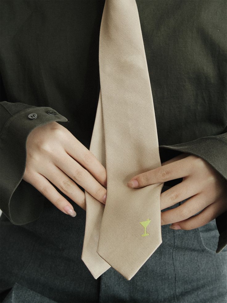 Elevate your style with Lost Pattern's exquisite silk tie, perfect for both women and men. This sophisticated accessory is designed to add a touch of flare and personality to any outfit. Handcrafted from the finest silk and adorned with delicate embroidery of martini glass, this silk tie showcases a playful yet elegant design. This subtle detail adds a charming twist to your look, making a statement of individuality and style. Product Information: 100% silk tie for men & women 57" x 2. 8" (146x7cm) Embroidery Gifting perfect box included Dry clean Only Dapper Standard Tie Neckwear, Dapper Standard Tie For Work, Silk Ties For Work, Dapper Fitted Neckwear For Work, Classic Tie For Semi-formal Spring Occasions, Classic Semi-formal Ties For Spring, Classic Ties For Semi-formal Spring Occasions, Elegant Silk Ties For Spring, Elegant Tie As A Spring Gift