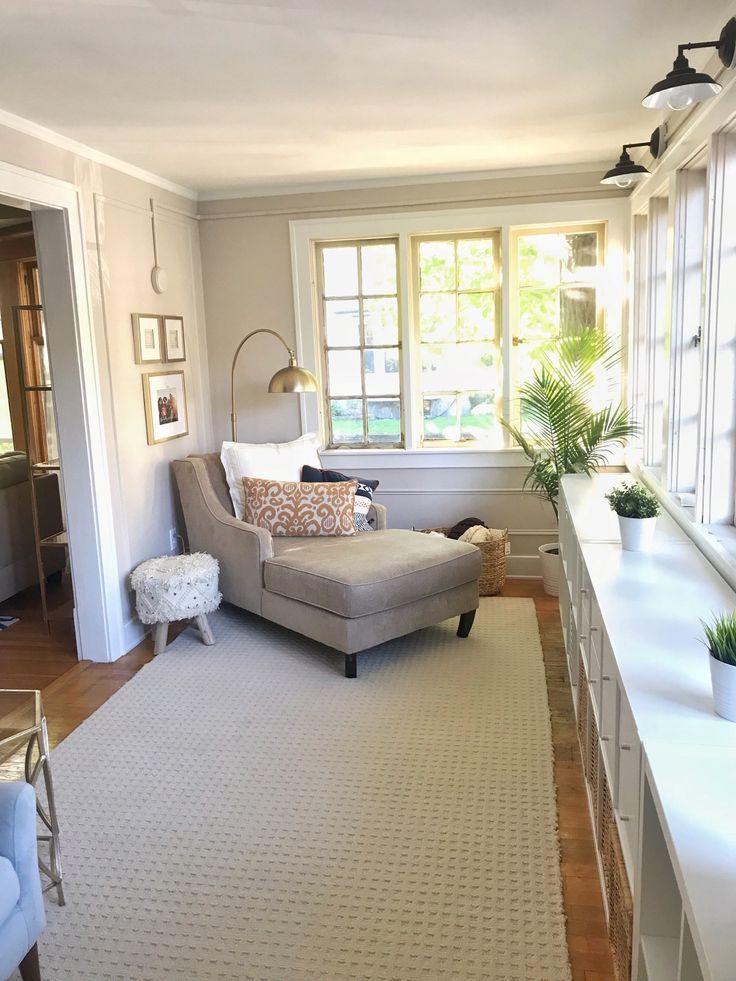 the living room is clean and ready to be used as a den or home office