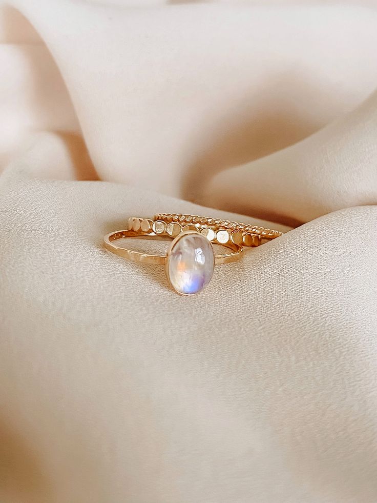 This gorgeous Rainbow Moonstone Ring is the focus of this handmade ring. It’s a Unique rainbow color in a beautiful natural stone. This beautiful moonstone ring is a gift or gift for yourself, it will illuminate your best qualities and bring forth creativity and inspiration. Details:• 14K gold filled & sterling silver• band: hammered style• gemstone: Genuine Rainbow Moonstone• measures stone: 6mm x 8mmmeasure band: approx 1.0mm - 1.5mm shape: oval............................................***Mo Handmade Gold Moonstone Ring In Spiritual Style, Gold Moonstone Healing Ring, Handmade Gold Spiritual Moonstone Ring, Bohemian Moonstone Moon-shaped Crystal Ring, Rainbow Moonstone Ring, Rainbow Color, Moonstone Ring, Sterling Silver Bands, Necklace Sizes