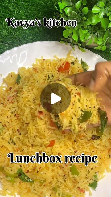 a white plate topped with yellow rice and vegetables