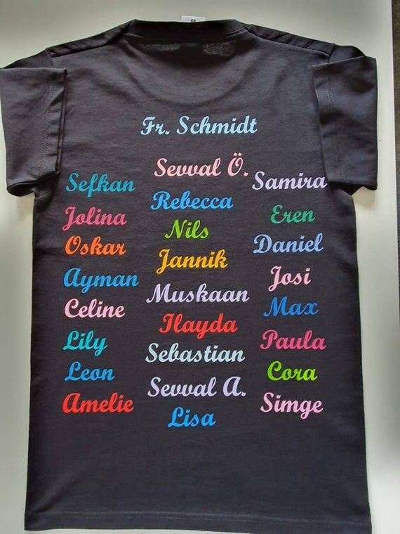 Personalized School Classes T-Shirt.The imprint on the back contains the name of the class teacher, as well as all the names of the students.The print on the front contains the name of the class.Printing can be either monochrome or in colorful.Please arrange all requests with us before purchasing.The minimum purchase quantity is 15 pieces.This is a specially made product for you.Depending on the scope of requests and quantities, the delivery time is about 4 weeks.The T-shirt is washable on the l Black T-shirt For Back To School, Black Graphic Print T-shirt For School, Black Text Print T-shirt For School, Black T-shirt With Screen Print For School, Black Screen Print T-shirt For School, Back To School Black Graphic T-shirt, Black T-shirt For Back To School Events, Black Graphic Print T-shirt For Back To School, Black Text Print Top For Back To School