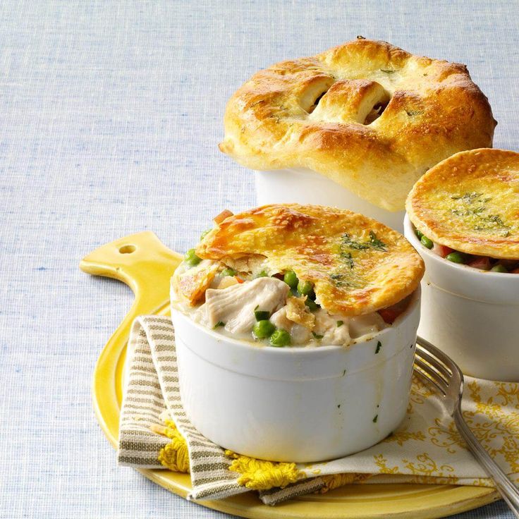 two white dishes filled with chicken pot pies