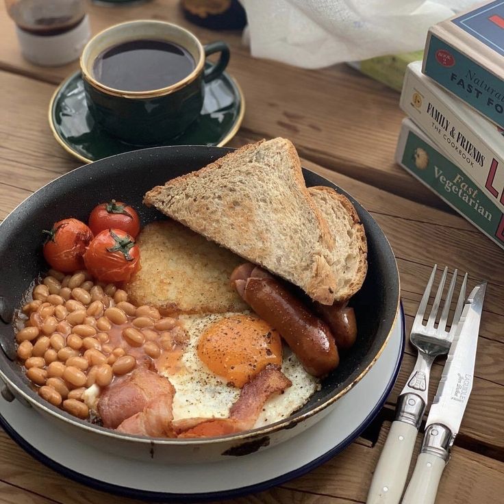 an english breakfast with eggs, beans, tomatoes and toast