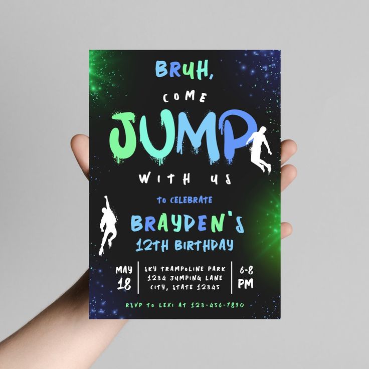 a hand holding up a birthday card with the words jump written in blue and green