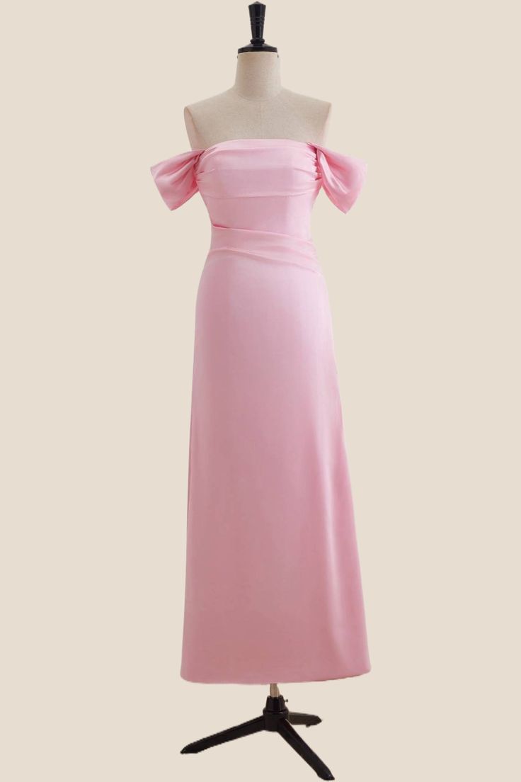 a pink dress on a mannequin stand