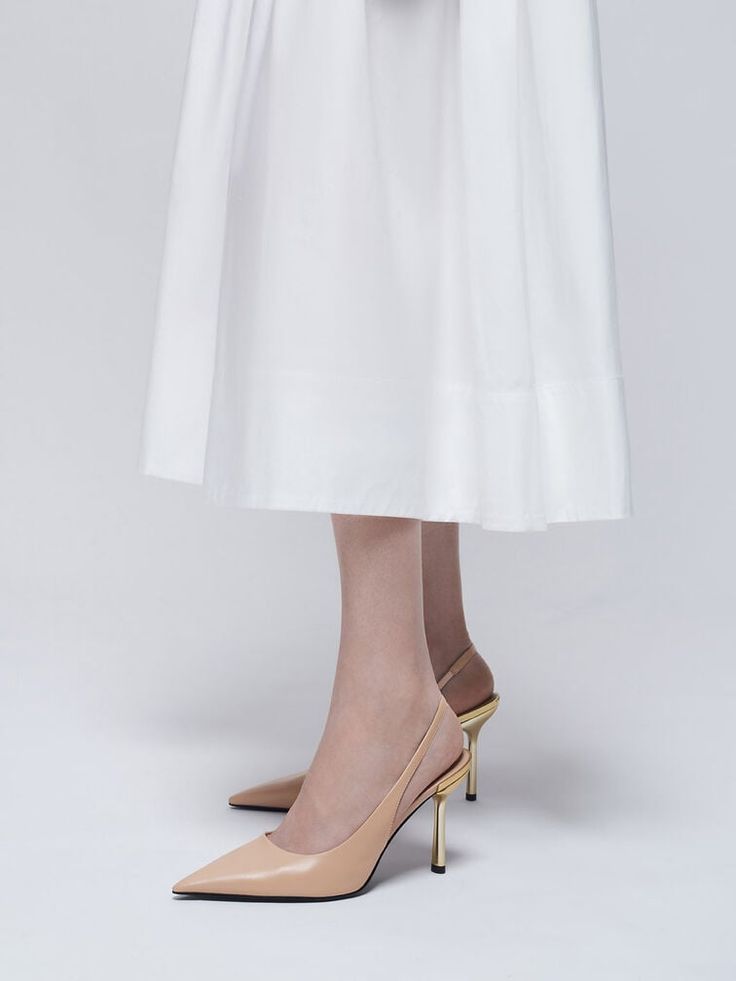 Polished and understated, this pair of nude pumps is versatile enough to complement most outfits, from dressy to casual. Featuring striking gold-toned metallic heels, this stiletto-heeled pair will give both your confidence and stature a boost. Featuring a classic slingback style and a pointed-toed silhouette, they have a flattering leg-lengthening effect that is always a plus. Whether you wear them to the office or on date night, these shoes will always be a great choice. On Date, Brand Collaboration, Metallic Heels, Nude Pumps, Charles Keith, Slingback Pump, Clothes Gift, Trending Shoes, Always Be