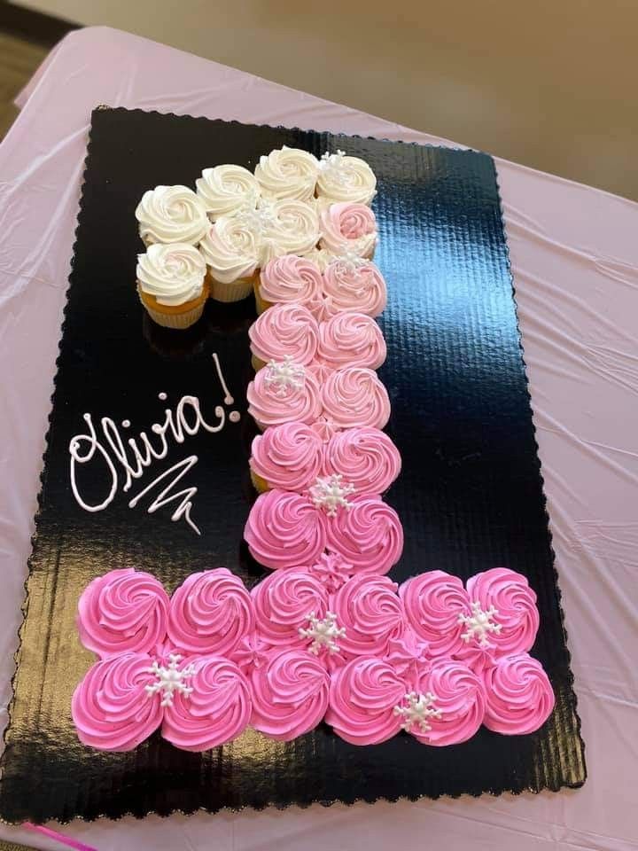 cupcakes are arranged in the shape of a letter