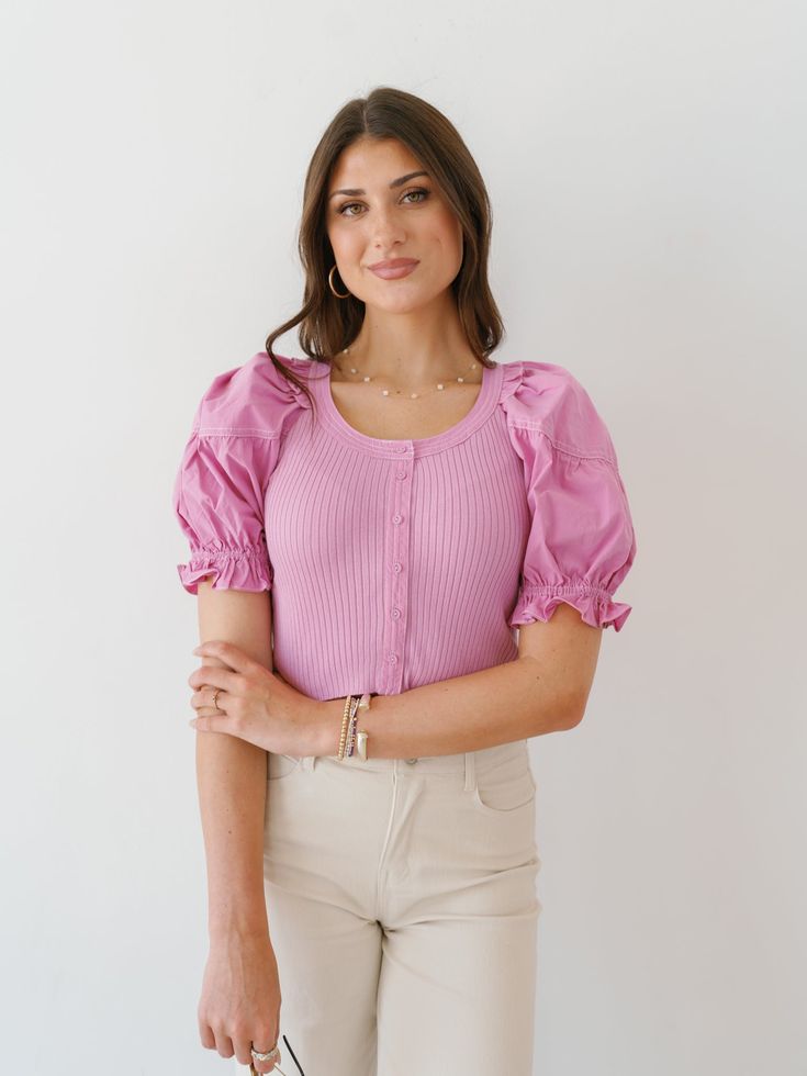 Enter true charm in the "Sierra Shine Top!" This feminine top is such a fun and vibrant top for the summer! It has contrasting fabrics on the sleeves and base that make it effortlessly appealing! Its soft knit base has a button up closure that is complemented by blouse sleeves! Fabric: self 50% viscose, 28% polyester, 22% nylon/ contrast 100% cotton Care: Hand wash cold, do not bleach, line dry, iron low if needed, do not tumble dry Model is wearing size small Measurements for size Small: should Spring Stretch Tops With Buttons, Fitted Knit Top For Day Out, Feminine Fitted Knit Top For Day Out, Summer Stretch Tops With Buttons, Spring Feminine Fitted Knit Top, Feminine Fitted Knit Top For Spring, Chic Knit Top For Spring Day Out, Stretch Summer Tops With Buttons, Chic Spring Knit Top For Day Out