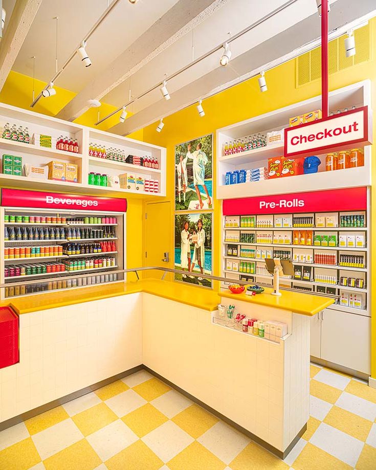 the inside of a store with yellow and white checkered flooring on the walls