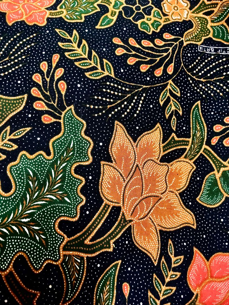 an intricately designed fabric with flowers and leaves