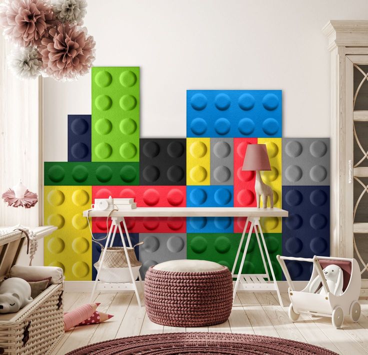 a living room with legos on the wall and furniture in front of it,