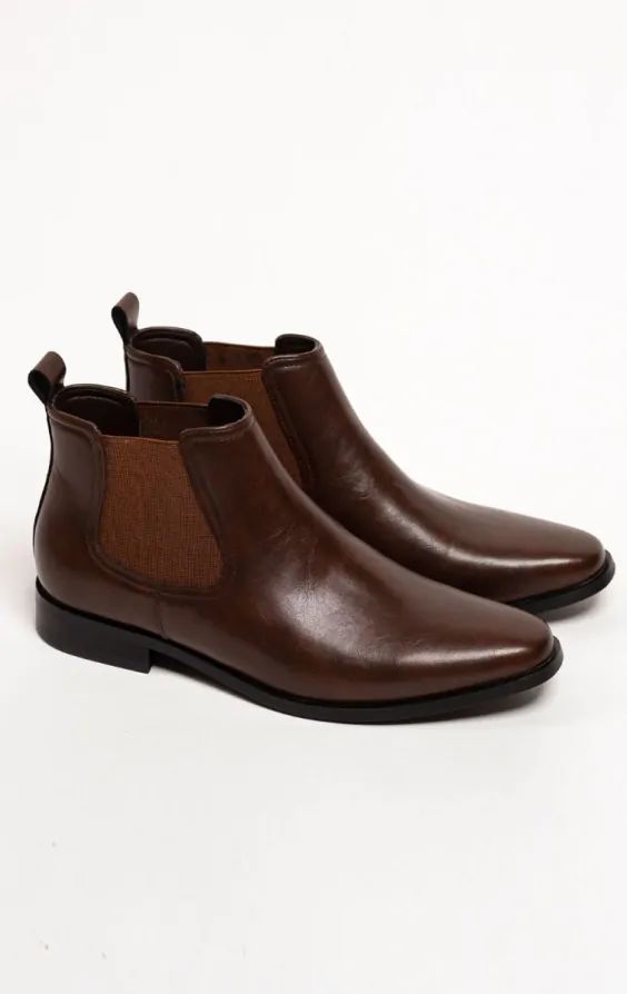 Introducing our dark brown Chelsea boots, the epitome of sophistication and timeless elegance. Crafted with meticulous attention to detail, these boots seamlessly blend classic design with contemporary flair. The sleek dark brown effortlessly elevates any outfit, whether it's a casual day out or a refined evening event. Dark Brown Chelsea Boots, Black Tie Tuxedo, Boys Waistcoat, Tweed Overcoat, Harris Tweed Jacket, Burgundy Tuxedo, Tuxedo Shoes, Double Breasted Waistcoat, Black Suit Wedding