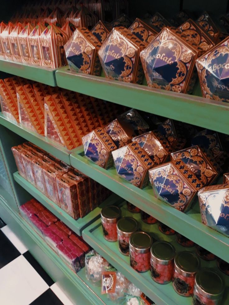 the shelves are filled with many different types of candy and candies in tins