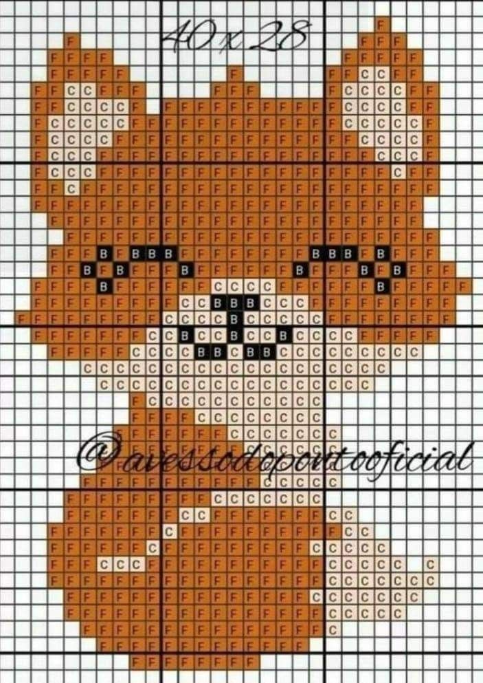 a cross - stitch teddy bear is shown in orange and black