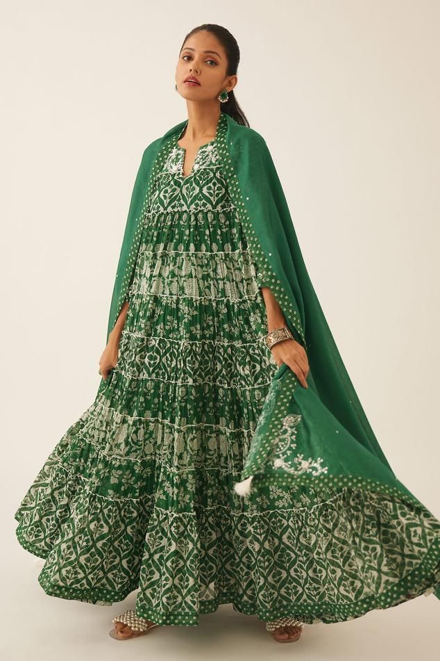 Green cotton chanderi tiered anarkali with floral hand block print and sequin, tassel, bead work on yoke. Paired with cotton slip, hand block printed straight pant and silk chanderi dupatta with printed border on the edges.
Components: 4
Pattern: Hand Block Printed, Embroidery
Type Of Work: Floral, sequin, bead, tassel
Neckline: Notched
Sleeve Type: Three quarter
Fabric: Anarkali: Cotton Chanderi, Slip and Pant: Cotton, Dupatta: Silk Chanderi
Color: Green
Other Details: 
Elasticated waist at the Bollywood Style Chanderi Sharara With Block Print, Designer Block Print Anarkali Set In Mulmul, Mulmul Anarkali Set With Block Print, Green Chanderi Anarkali Set With Block Print, Block Print Anarkali Set In Mulmul, Traditional Anarkali Set With Block Print For Transitional Season, Traditional Anarkali Set With Block Print For Diwali, Traditional Anarkali Set For Diwali With Block Print, Bohemian Anarkali Set With Printed Motifs For Eid