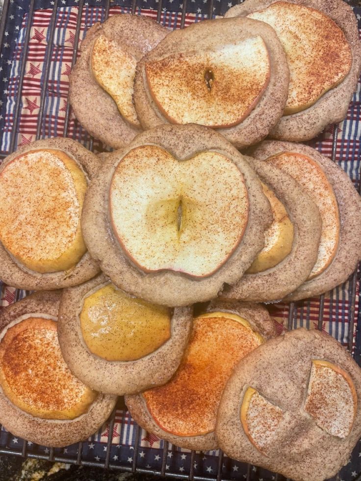 some apple pies are on a cooling rack