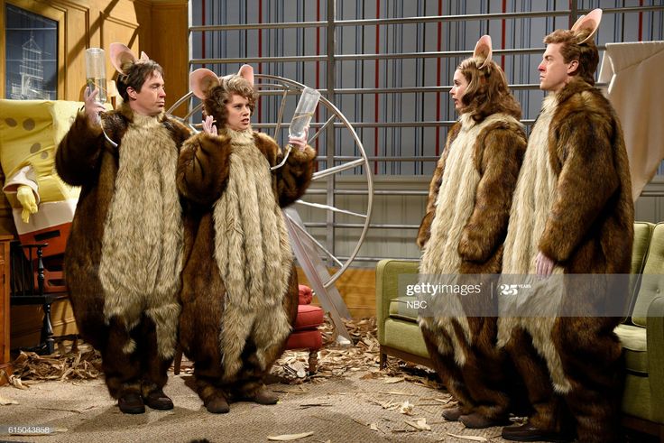 three men dressed in animal costumes stand next to each other on the set of tv show