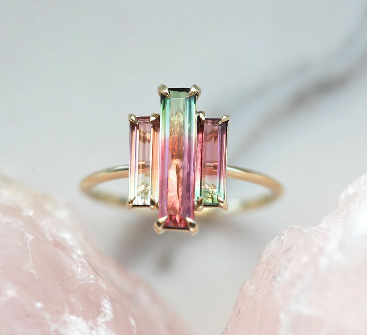 Three stone natural watermelon tourmaline ring. SOLD Similar can be made with other similar tourmalines. The design can be made with gemstones of your choosing. If you would prefer a custom ring, please contact us before purchase. Please take a look at our similar designs at the following links: https://www.etsy.com/listing/498675762/tourmaline-ring-diamond-engagement-ring https://www.etsy.com/listing/523459035/tourmaline-ring-diamond-engagement-ring Details; Main stone: bicolor watermelon tourm Watermelon Tourmaline Engagement Ring, Bijoux Art Deco, Pink Wedding Rings, Watermelon Tourmaline Ring, Baguette Engagement Ring, Tourmaline Engagement Ring, Ring Baguette, The Bling Ring, Ring Rosegold