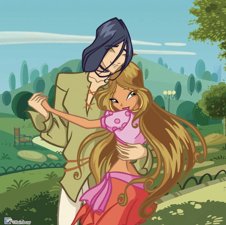 a man and woman are hugging in the park, one is wearing a pink dress