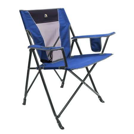 a blue and black folding chair with a cup holder on the arm rests against a white background