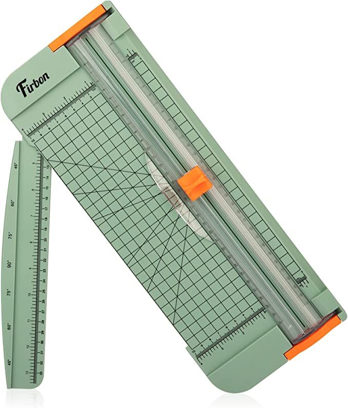 a green and orange ruler with an orange handle