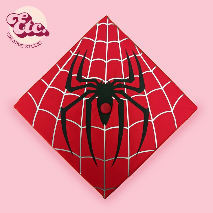 a red spider - man napkin on a pink background with the caption creative studio